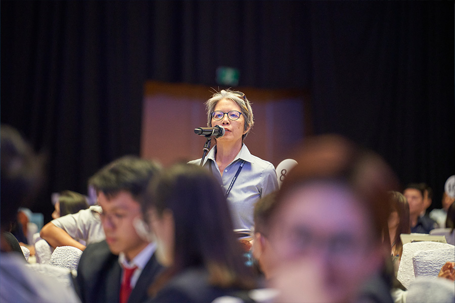 A participant posing a question to DPM Lawrence Wong during the dialogue session.