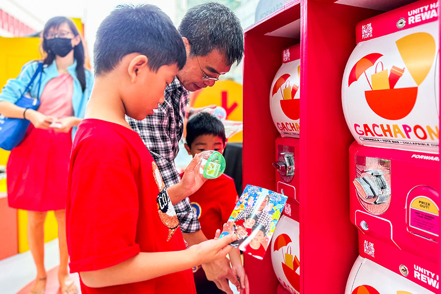 A family of Singaporeans redeeming their prize at the gachapon
