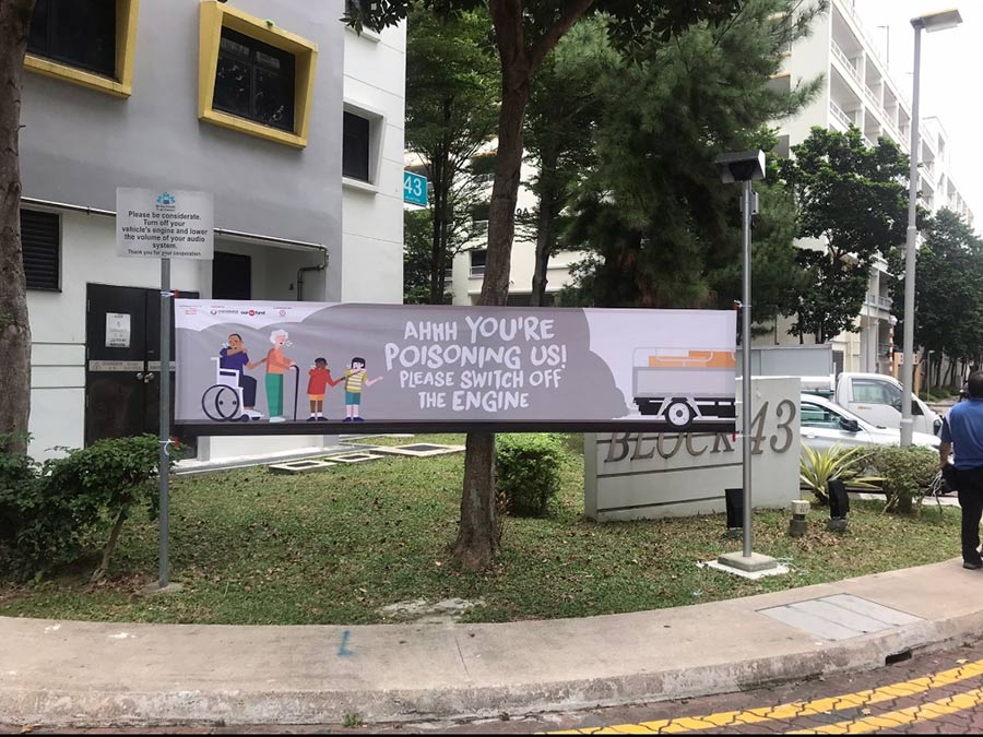They even set up a banner encouraging motorists to switch off their engines to prevent exhaust fumes drifting into apartments of residents.